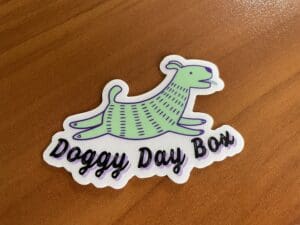 Doggy Day box sticker placed on the table
