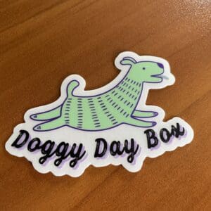 Doggy Day box sticker placed on the table
