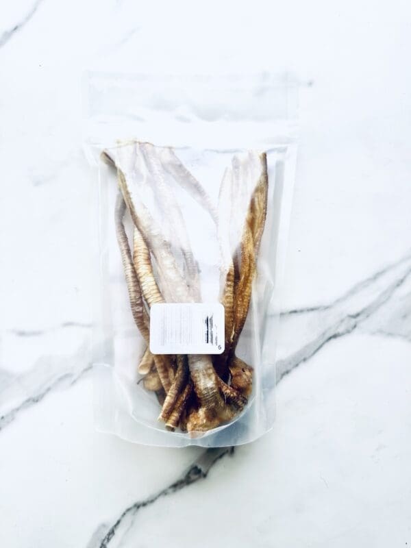 Dried pig ears in a plastic bag.