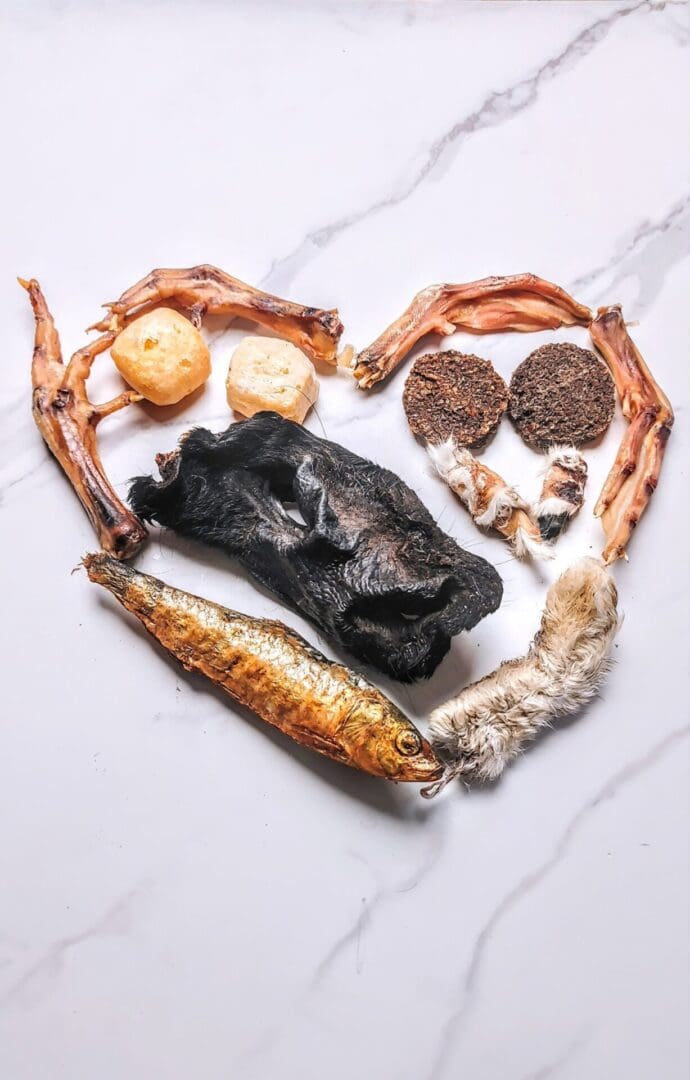 Assorted dried foods arranged in a heart shape.